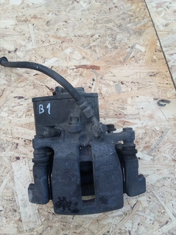 Суппорт тормозной Volvo 36001375, задний левый