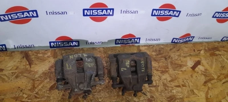 Суппорт тормозной Nissan Note 2006-2013 41011AX60A E11 HR16, передний левый