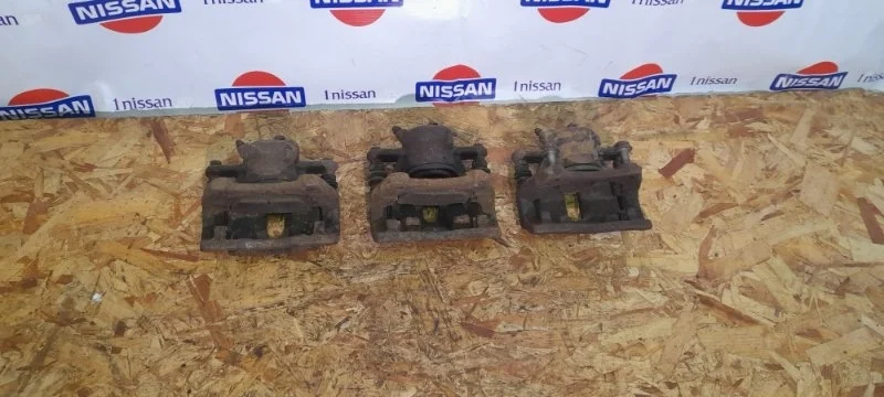 Суппорт тормозной Nissan Micra 2002-2010 41011AX601 K12 CR14, передний левый