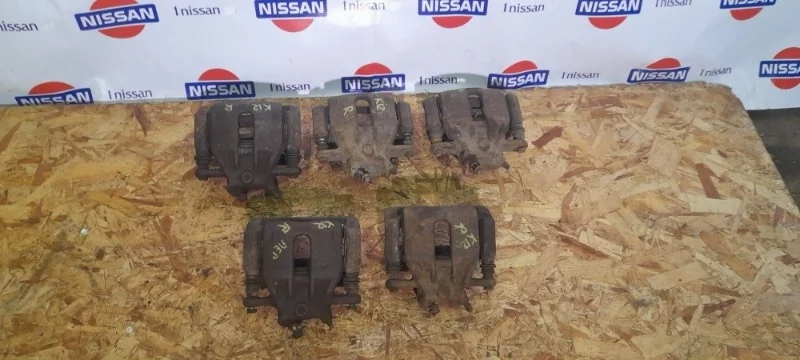 Суппорт тормозной Nissan Micra 2002-2010 41001AX601 K12 CR14, передний правый