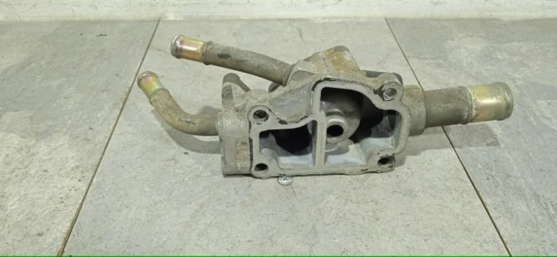 Корпус термостата NISSAN PRIMERA 2001-2008 130499F600 P12