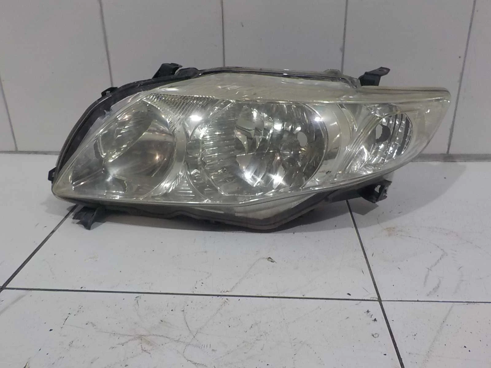 Фара Toyota Corolla Fielder X (2006—2012)  Лево