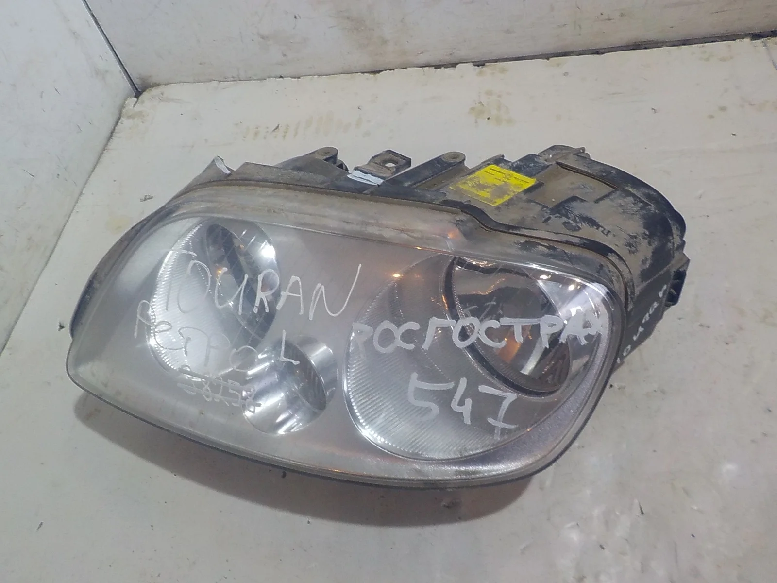 Фара Volkswagen Caddy III (2004—2010) Перед Лево