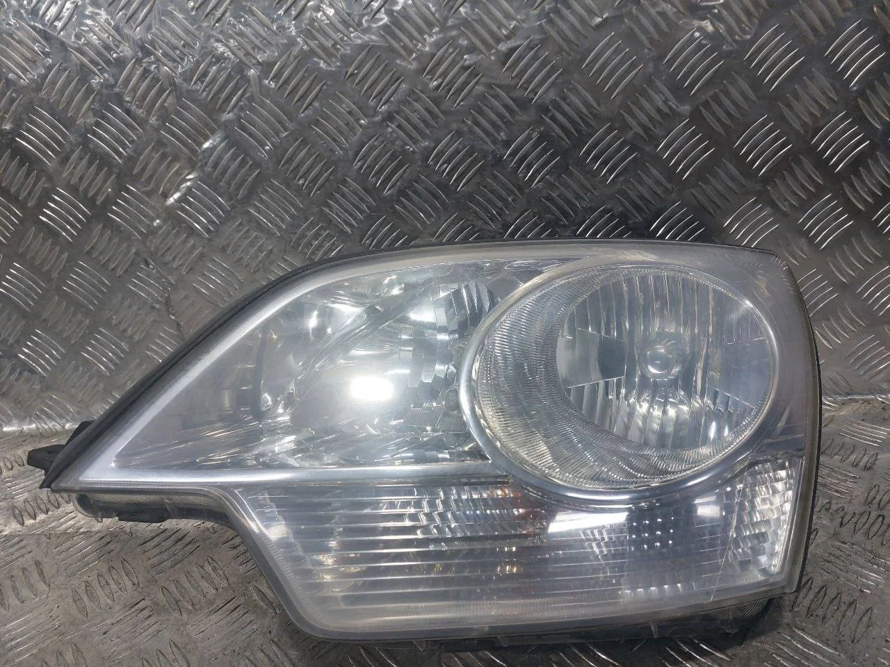 фара левая Opel Antara