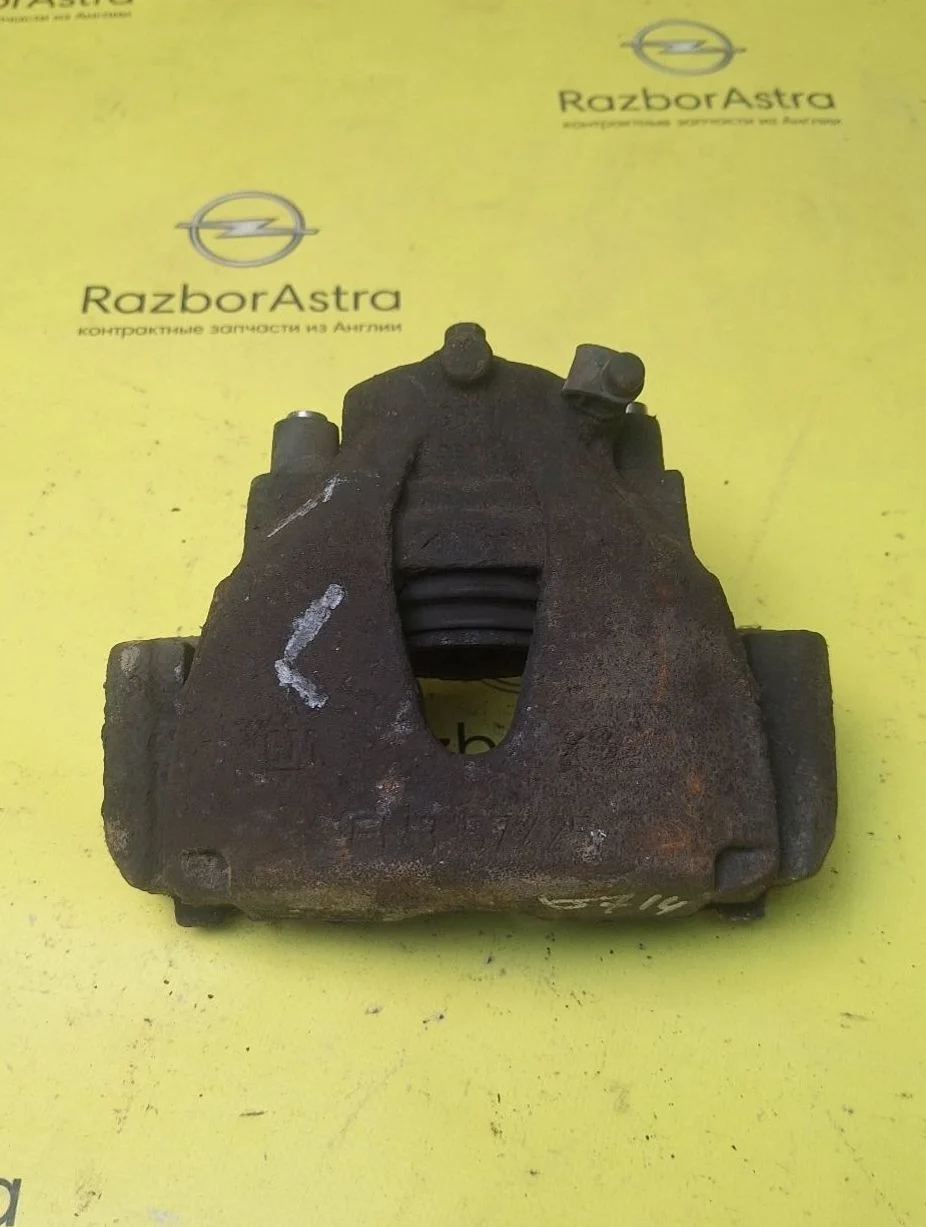 Суппорт тормозной передний левый Opel Astra H (2004—2007)