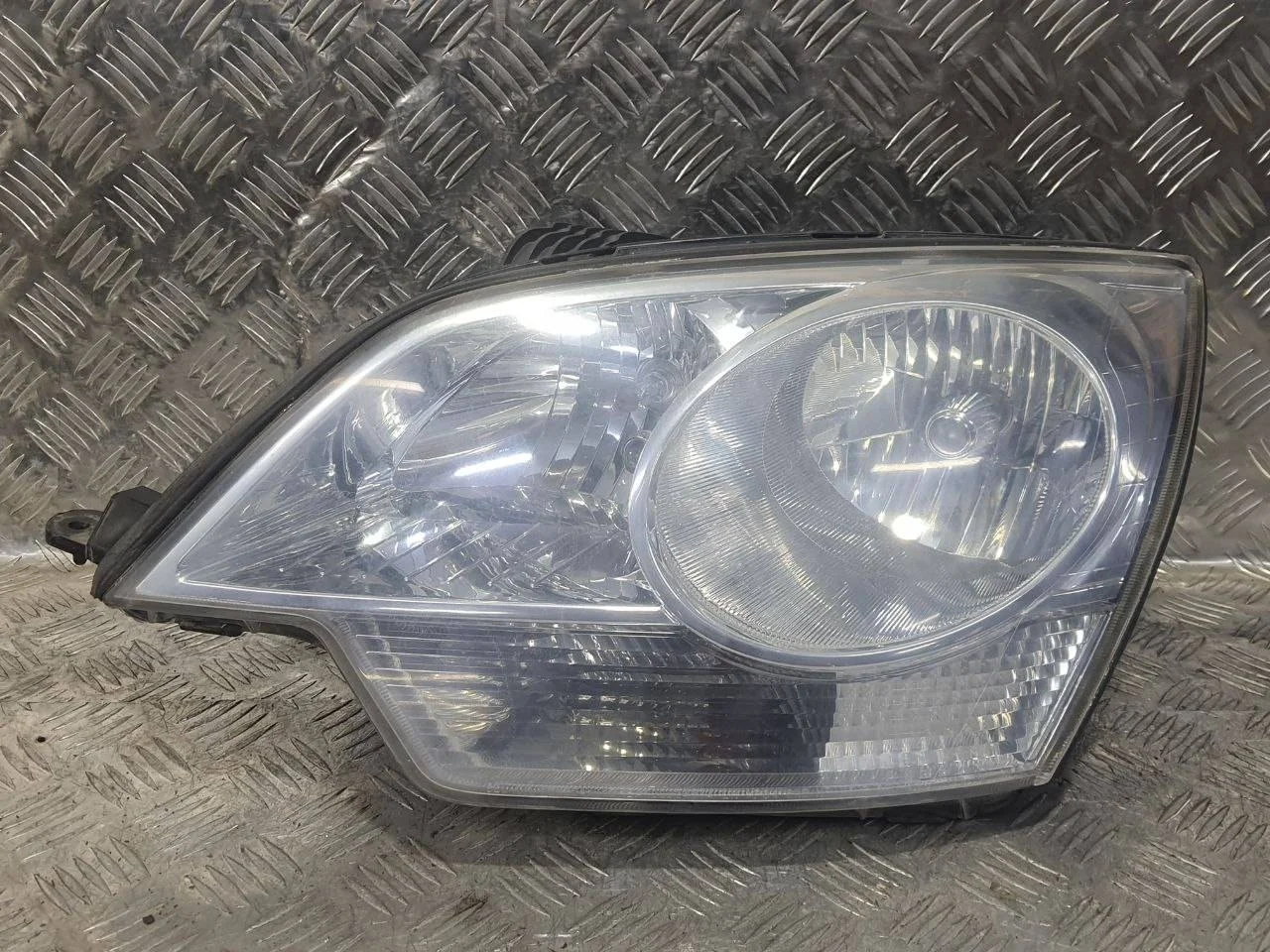 фара левая Opel Antara