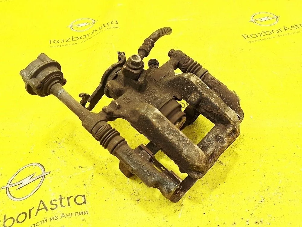 Суппорт тормозной задний правый Opel Astra GTC J (2009—2012)