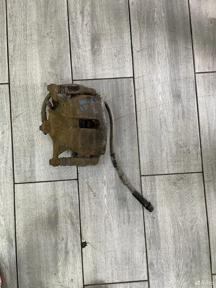 Суппорт тормозной передний левый skoda octavia a7