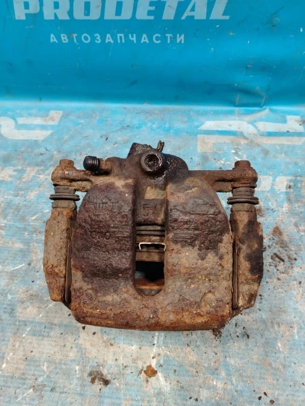 Суппорт тормозной передний левый Skoda Rapid