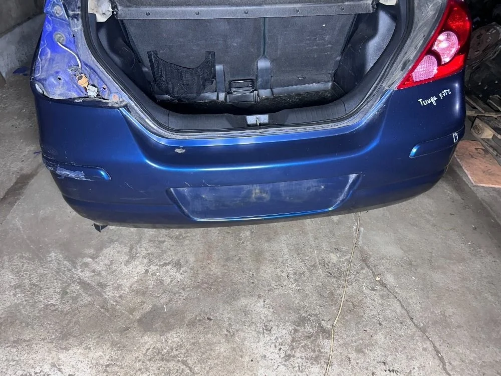 Бампер задний Nissan Tiida C11 Хэтчбек