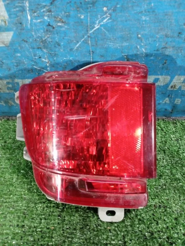 Фонарь в бампер задний левый Toyota Land Cruiser