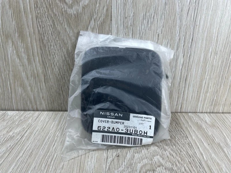 Заглушка буксировочного крюка Nissan X-Trail 2007-2015 622A03UB0H T31, передняя