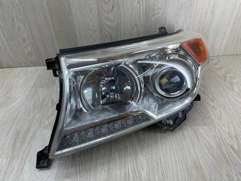 Фара Toyota Land Cruiser 8118560F30 J200, передняя левая