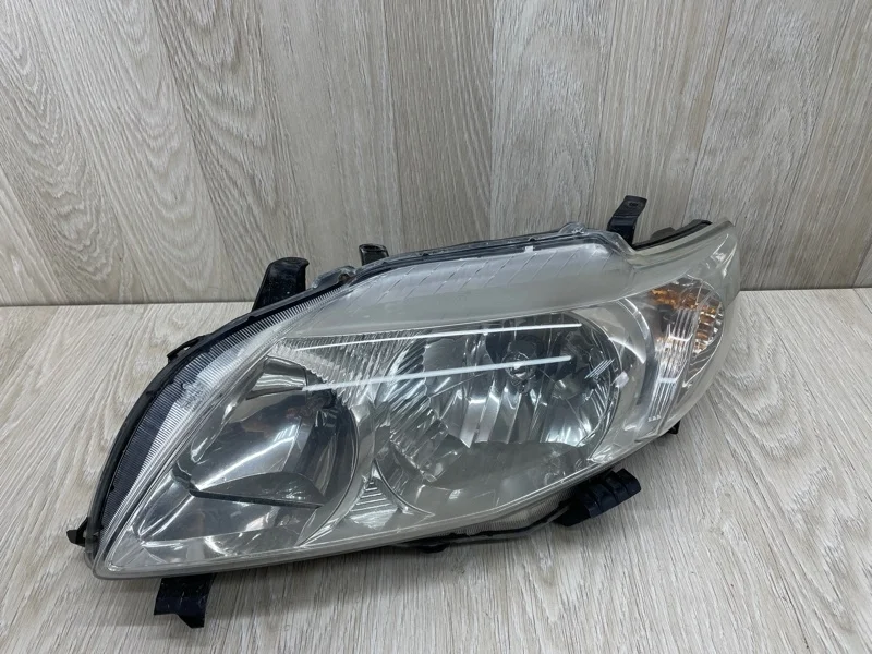 Фара Toyota Corolla 8117012A60 E150, левая