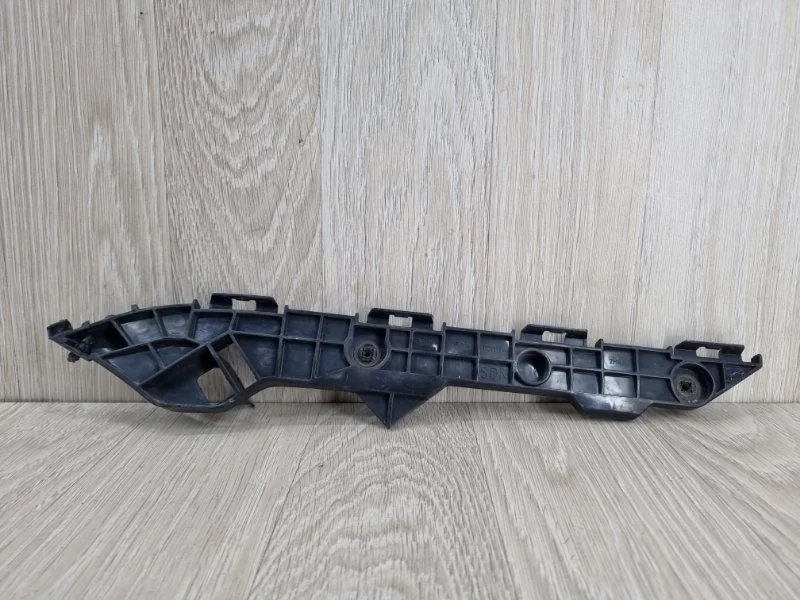 Кронштейн бампера Toyota Corolla 5215612290 E150, задний левый