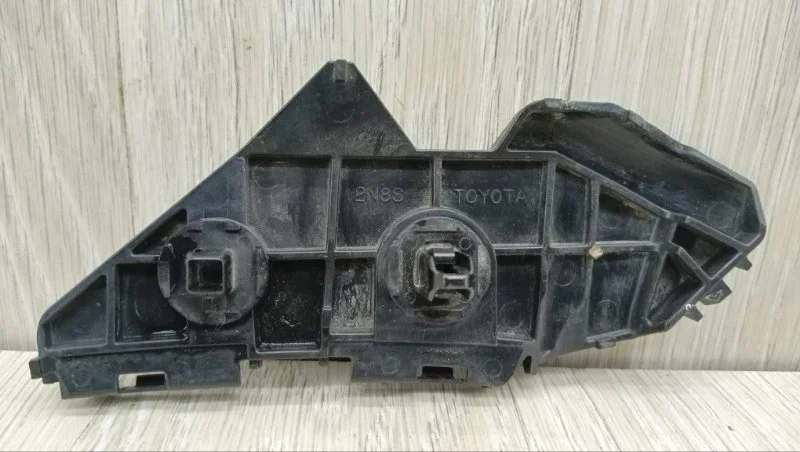 Кронштейн бампера Toyota Corolla 5215812090 E150, задний левый