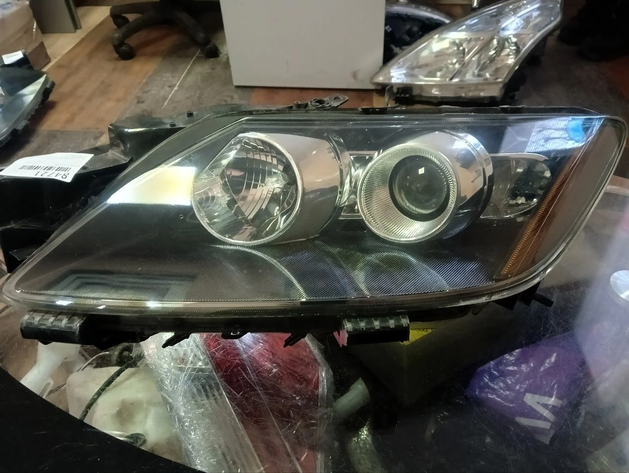 Фара галоген Mazda CX-7 2006-2012 EH11510L0A, передняя левая