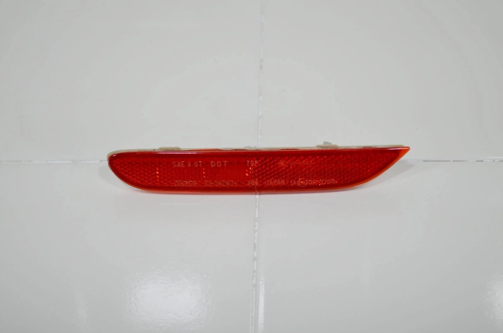 Отражатель NISSAN QASHQAI 2013+ 26565JJ90A J11, задний левый