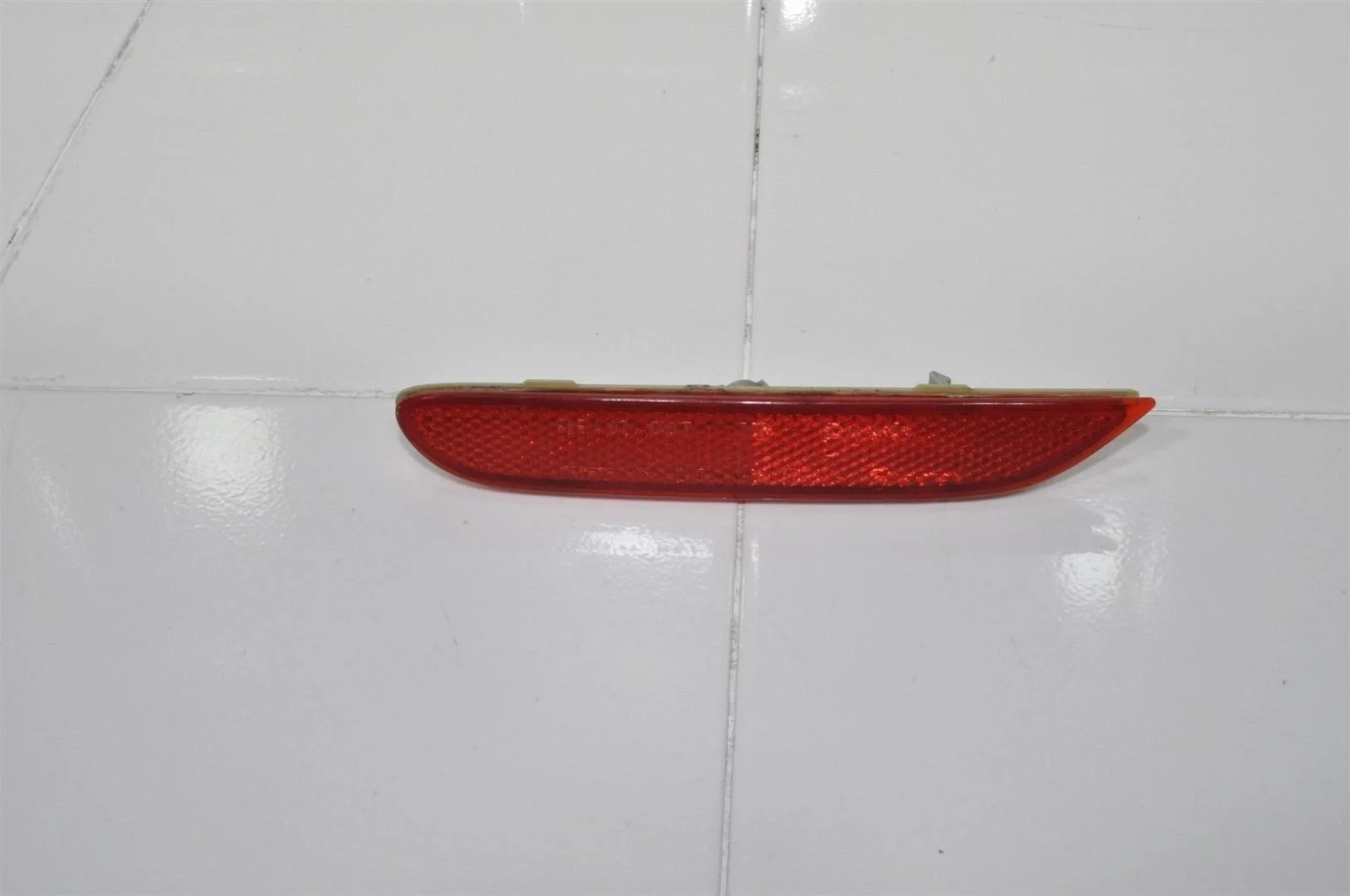 Отражатель NISSAN QASHQAI 2013+ 26565JJ90A J11, задний левый