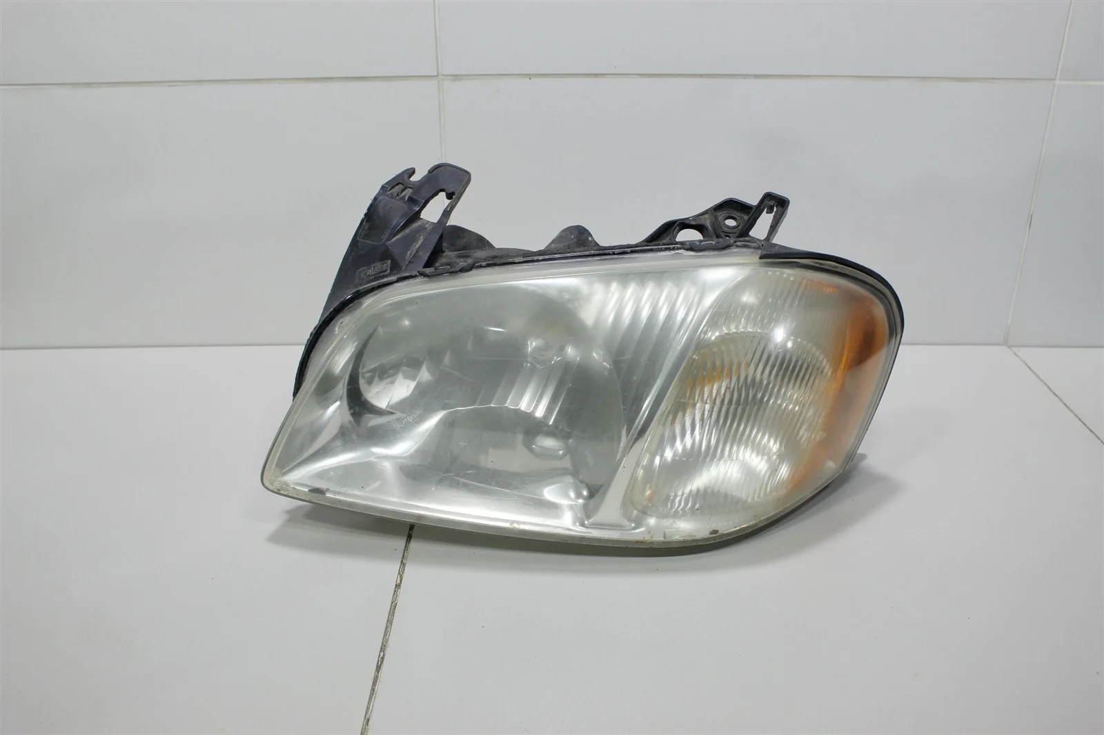 Фара MAZDA TRIBUTE 2000+ EC0151040K 1, левая