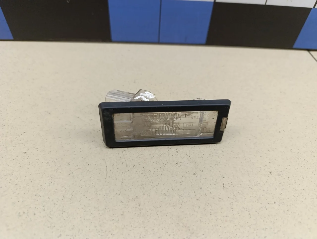 Фонарь подсветки номера Duster 2012>