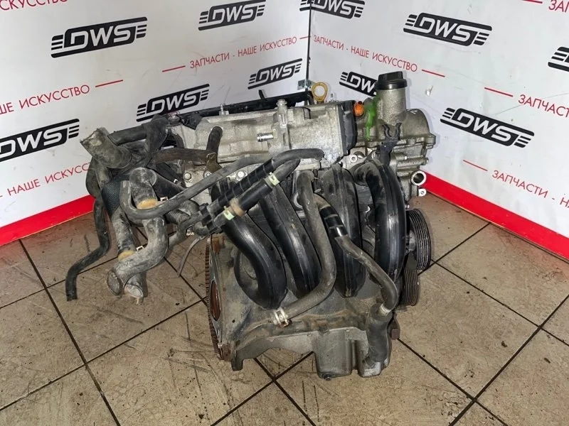 Двигатель Toyota Ractis 1900023220 SCP100 2SZ-FE