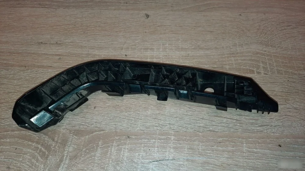 Кронштейн бампера Kia Picanto 3 8651507500, задний левый