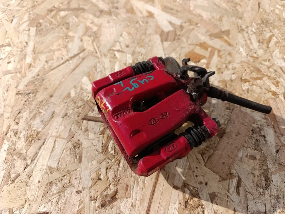 Суппорт тормозной задний левый Kia ceed 2014 58310A2A30 КУПЕ G4FJ, задний левый