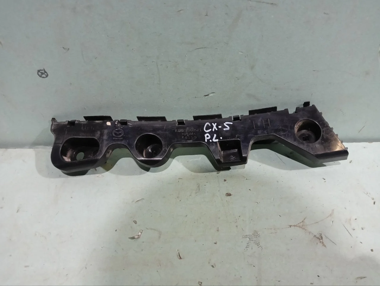 Кронштейн бампера Mazda CX-5 2011-2017 KD53502J1, задний левый