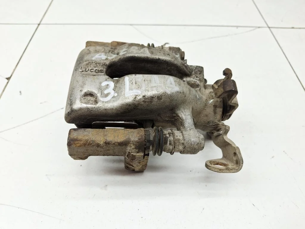 Суппорт задний левый Opel Astra 2010 H