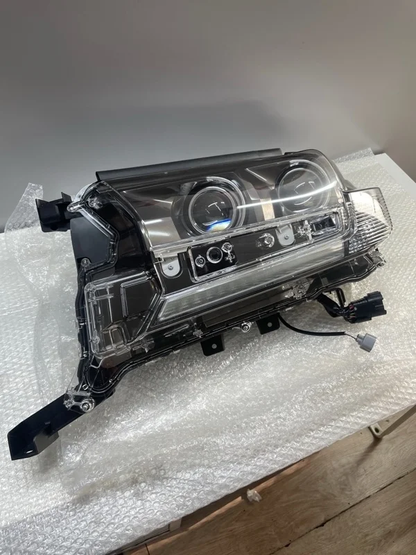 Фара левая TOYOTA Land Cruiser 200 2015> 8110660P40, передняя левая