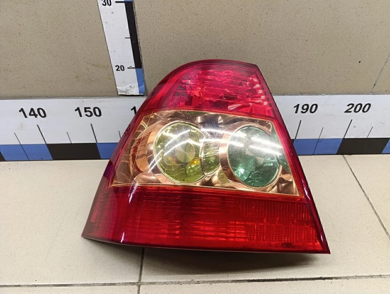 Фонарь задний левый Corolla E12 2001-2006