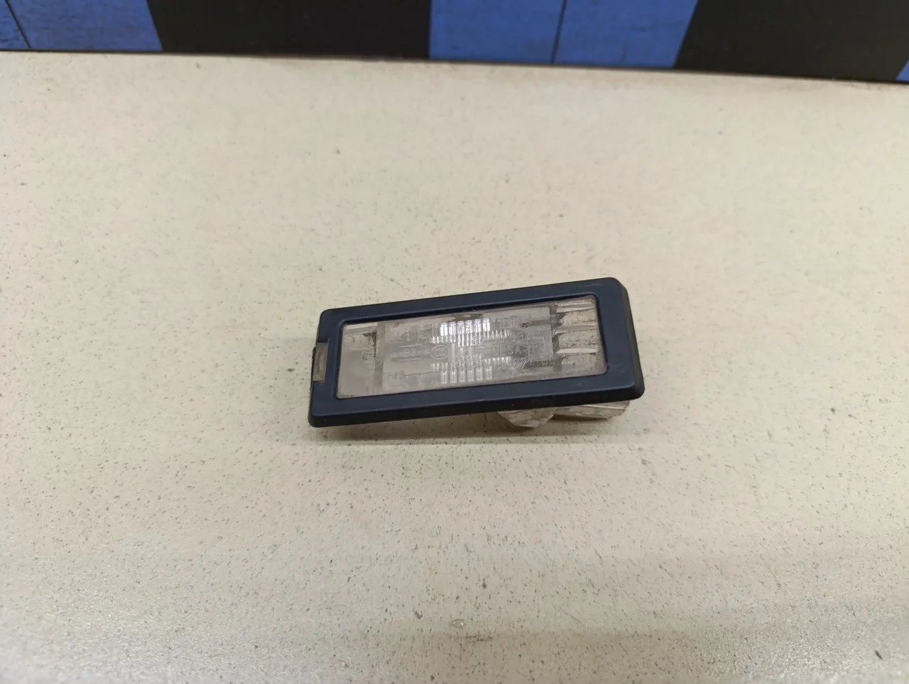 Фонарь подсветки номера Duster 2012>