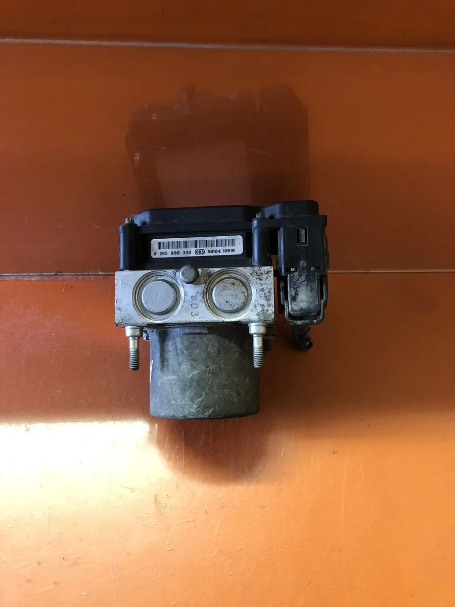 Блок (насос) ABS Nissan Primera P12 (2001—2008) P12 47660AV712