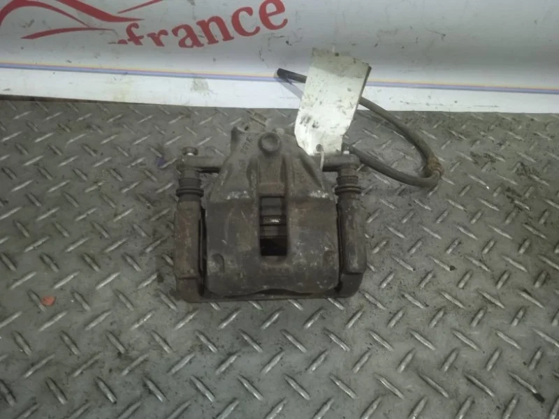 Суппорт тормозной Nissan Micra K12E   F L