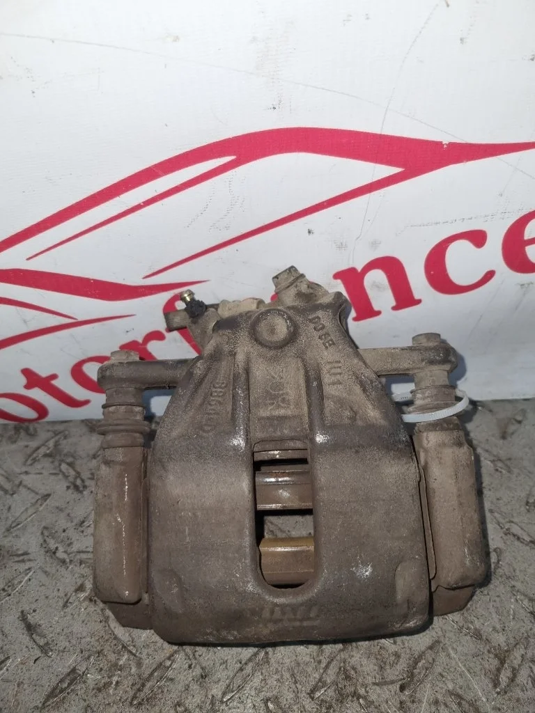 Суппорт тормозной Nissan Micra K12   F R