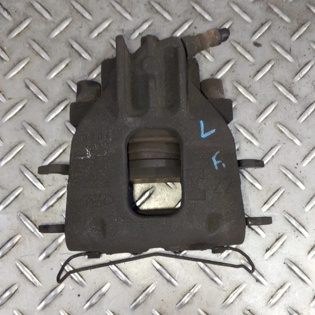 Суппорт тормозной Ford Focus 1   F L