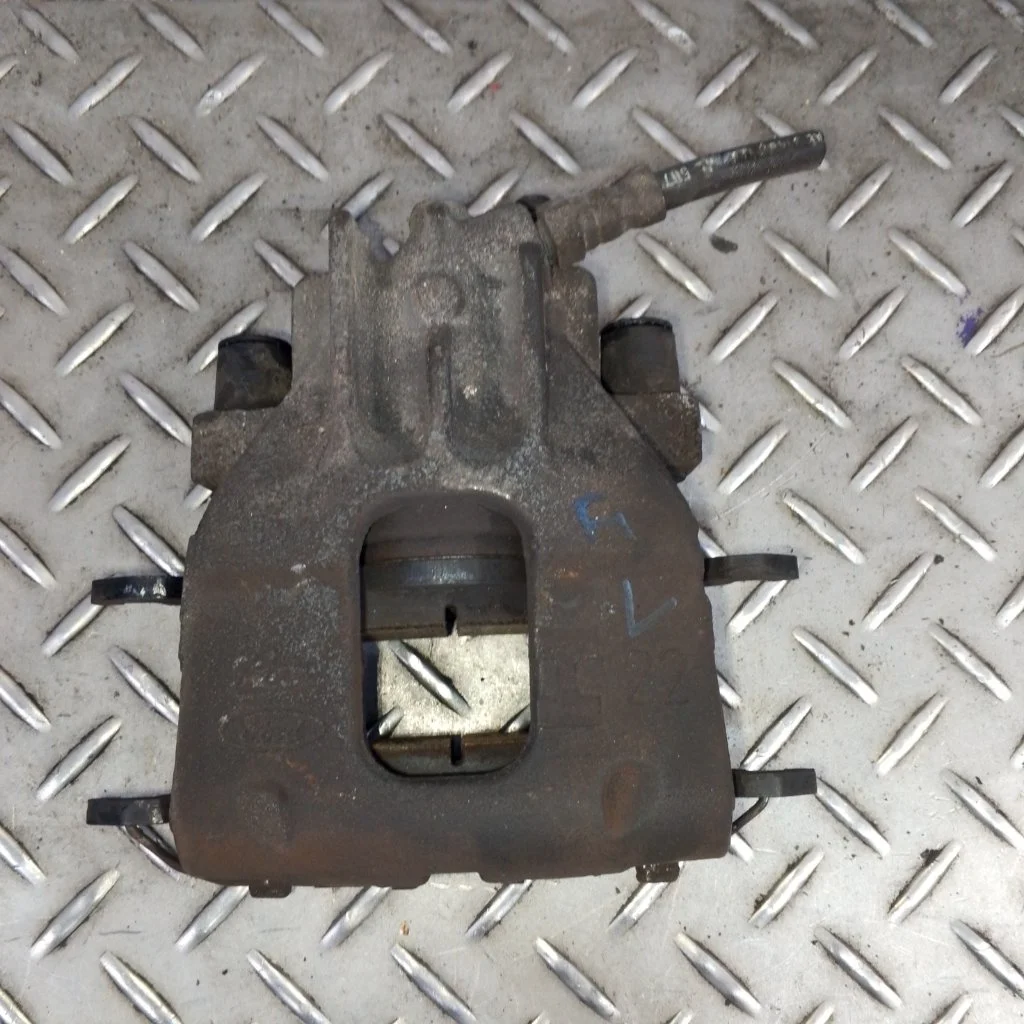 Суппорт тормозной Ford Focus 1   F L