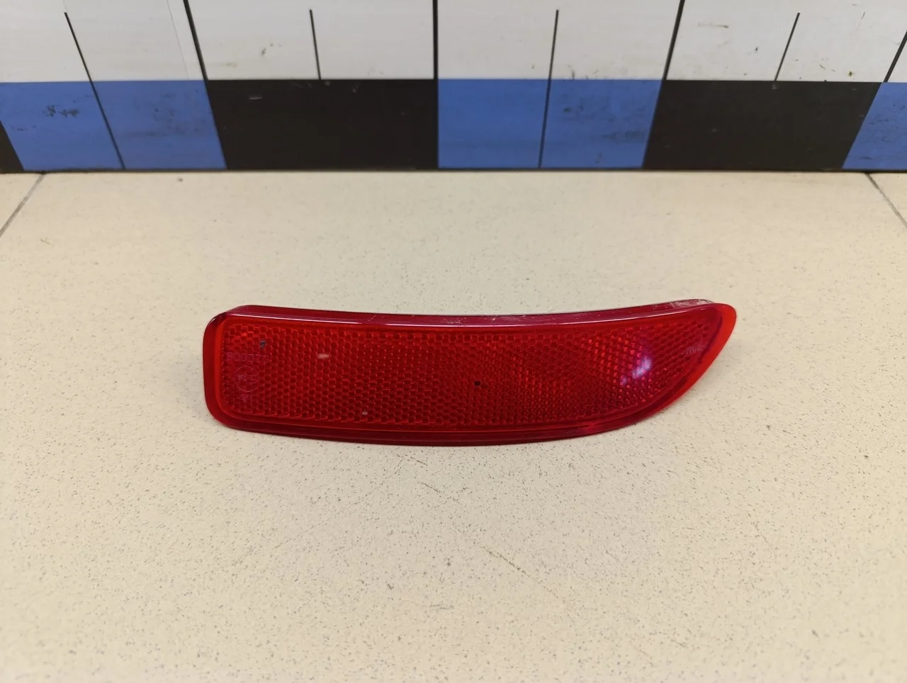 Отражатель в бампер задний левый Logan 2005-2014