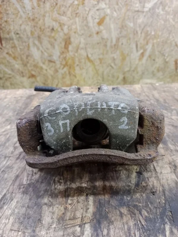 Суппорт тормозной Kia Sorento 2009-2020 XM