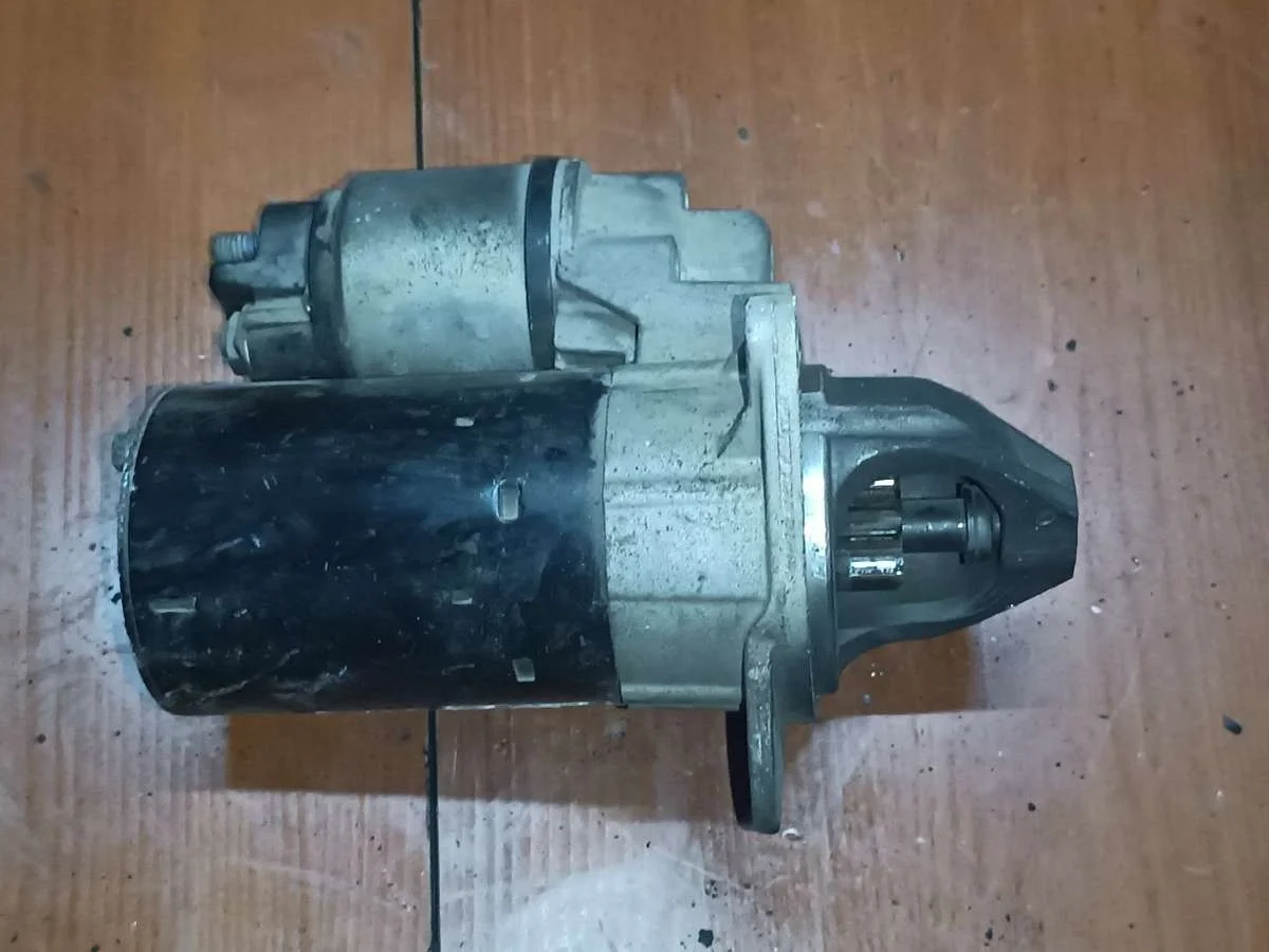 Стартер 0001107493 Opel Astra H 1.4 Дизель