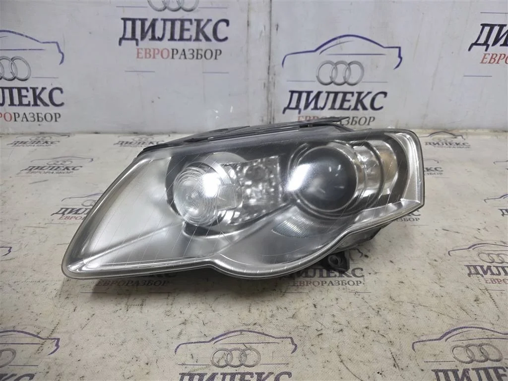 фара VW Passat (B6) 2005-2010 L -