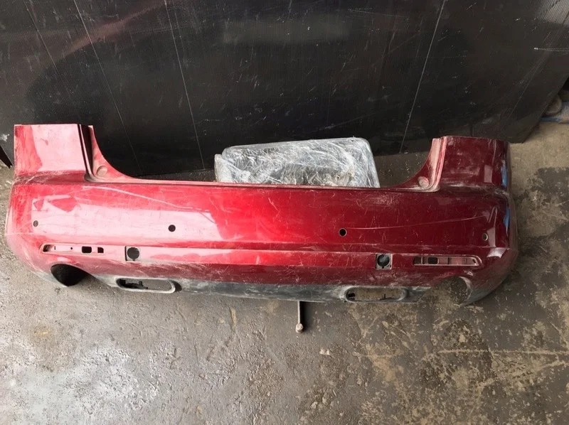 Бампер Mazda CX-7 2006-2012 EG2150221, задний