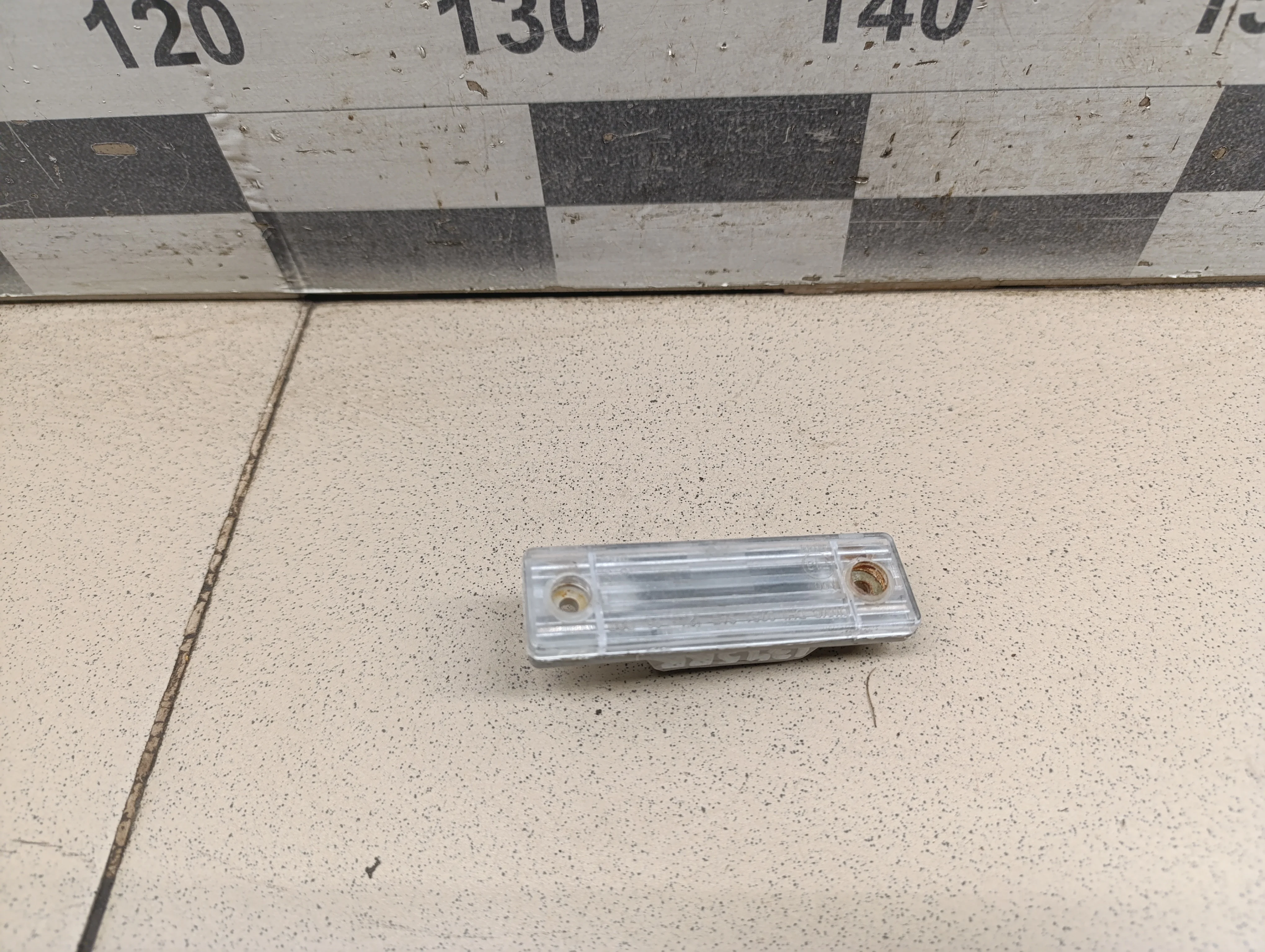 Фонарь подсветки номера Aveo (T200) 2003-2008