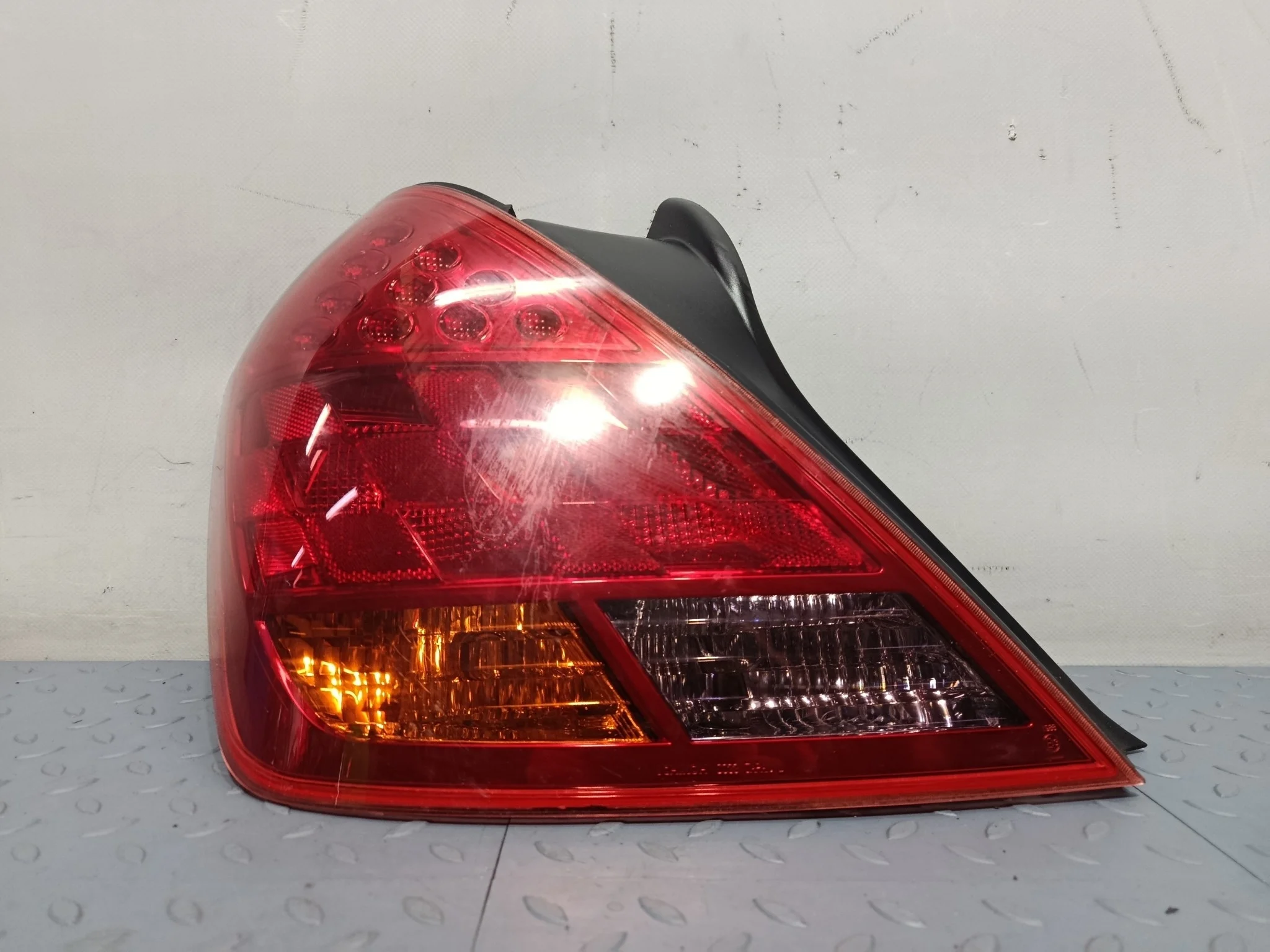 ФОНАРЬ NISSAN ЛЕВЫЙ 265559W50C  KB808