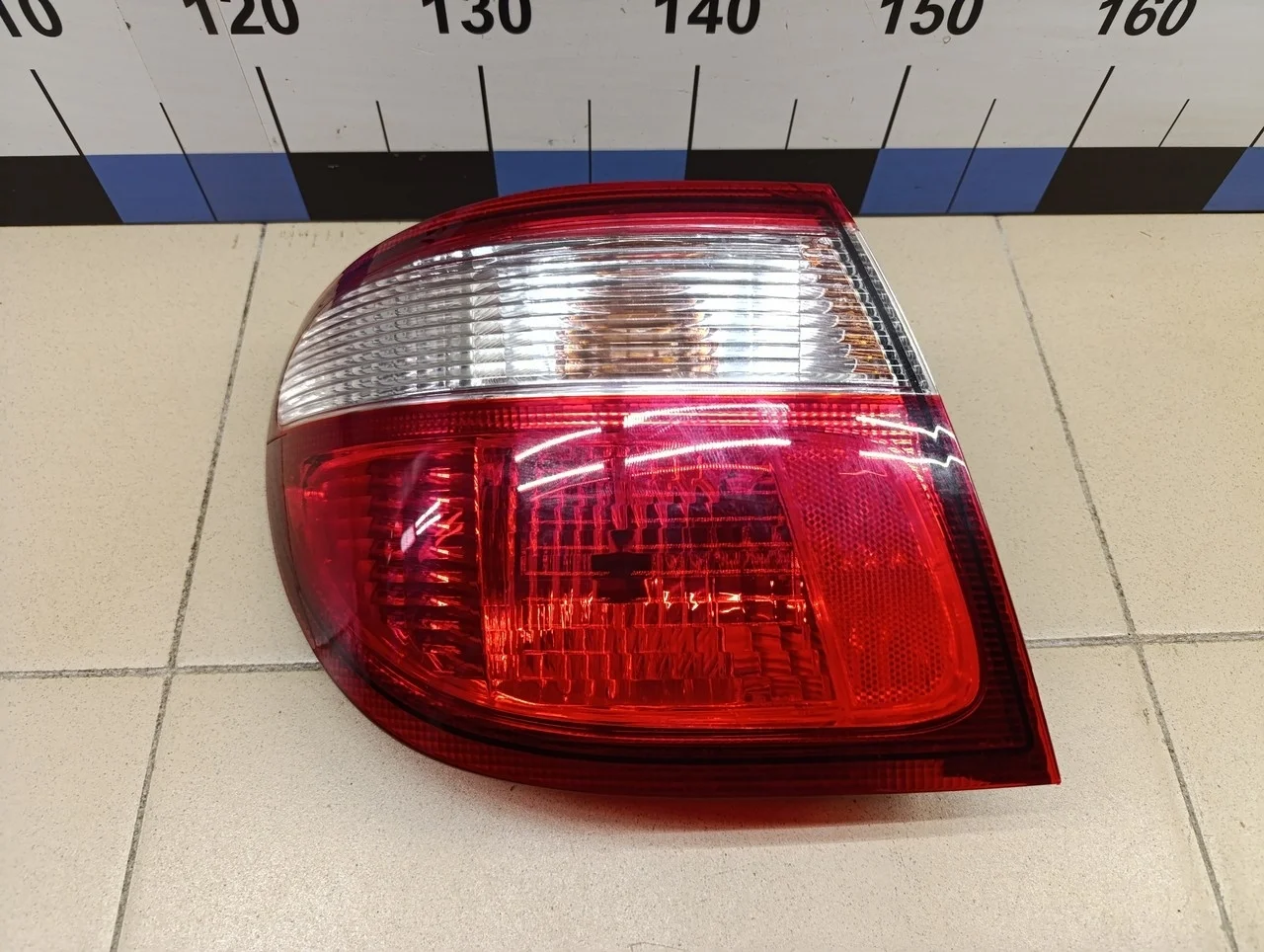 Фонарь задний наружный левый Almera N16 2000-2006