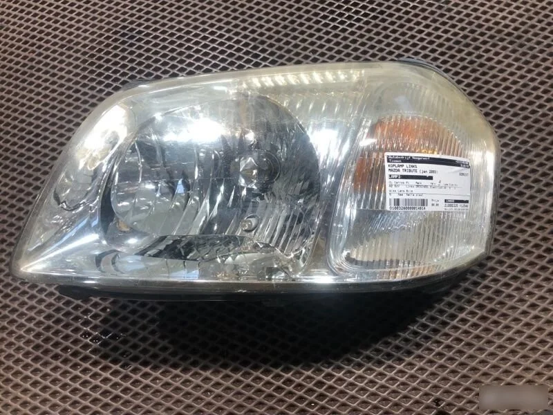 Фара левая Mazda Tribute I (2000—2004)