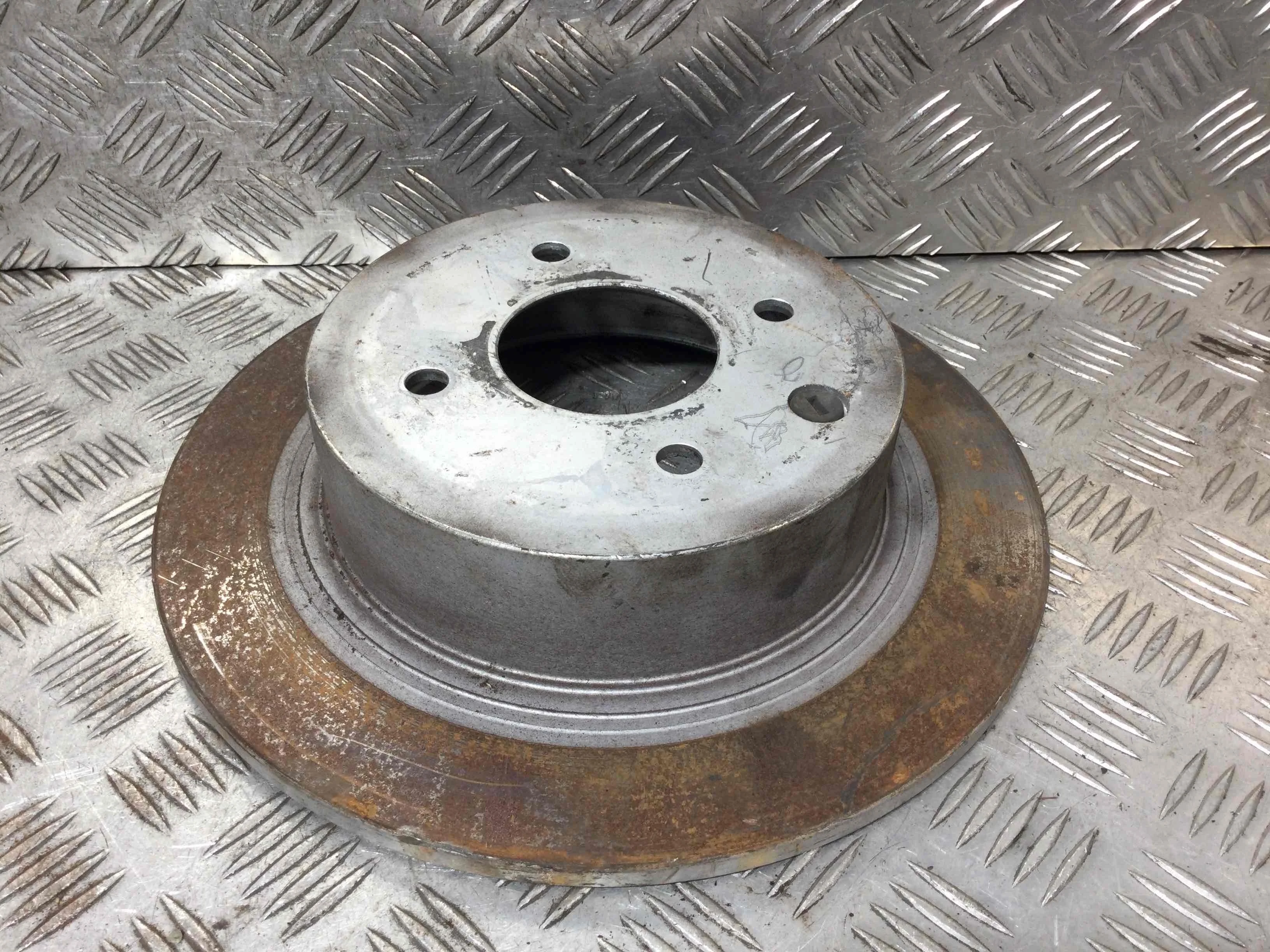 Диск тормозной задний Nissan Tiida Tiida C11 [рестайлинг] (2007-2014) бензин 1.6 i Механика Х/б