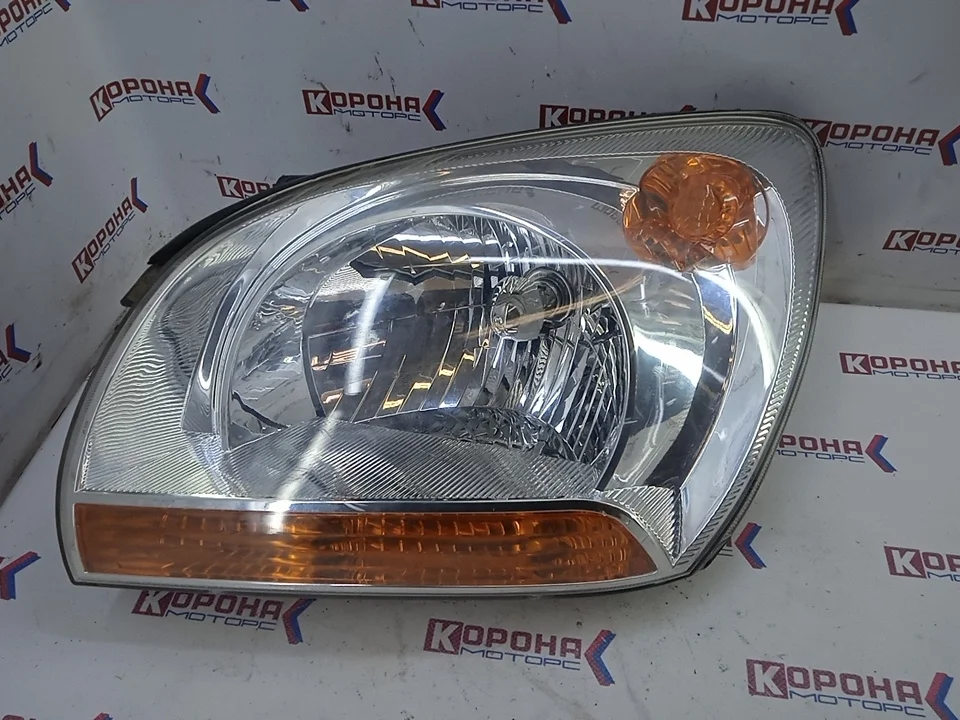 Фара KIA Sportage 2006 921011F001 KM D4EA, левая Б/У Дефект крепления