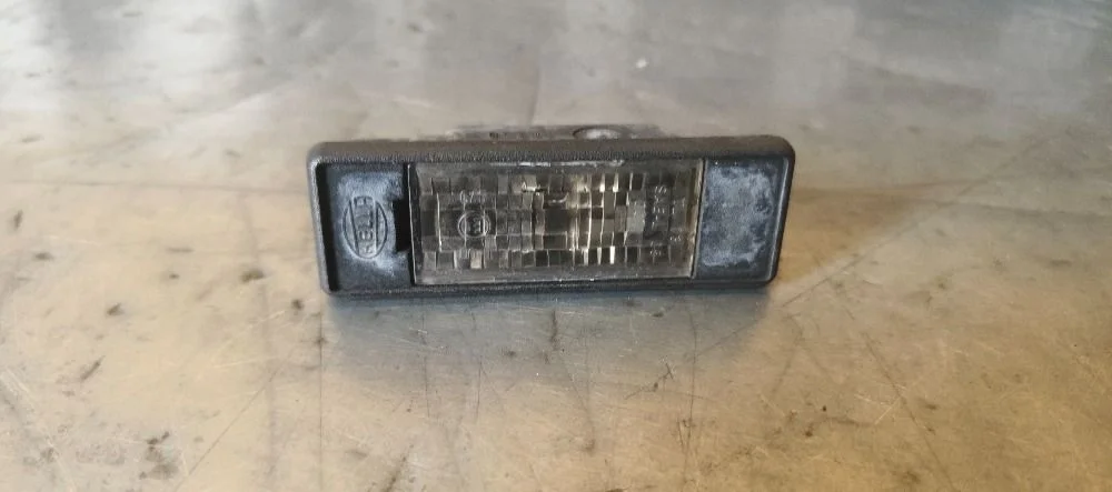 Фонарь подсветки номера Nissan Pathfinder III (2004—2010) 2008 GN0 - BLACK METALLIC